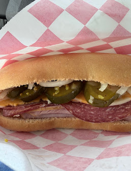 Salami sandwich with jalapeƱos, onions and cheese